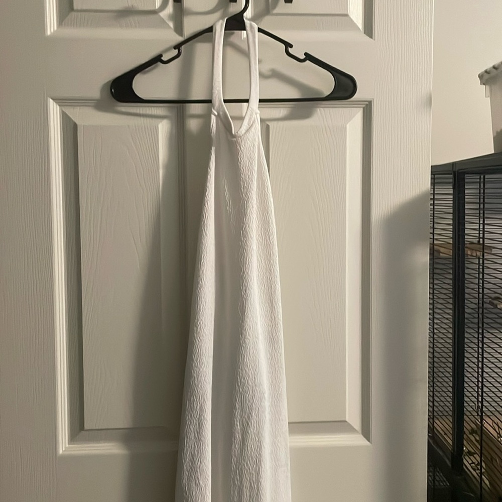 This is a white dress with a very beautiful open back to it!